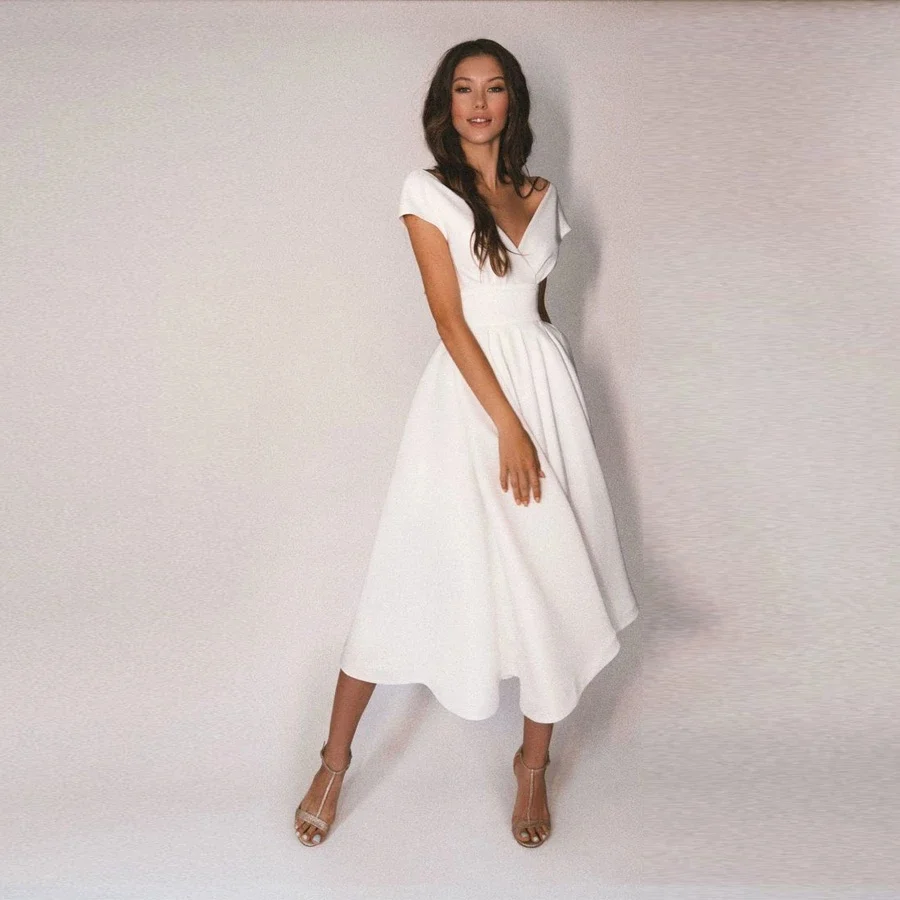 Sexy Deep V-Neck Wedding Dress Open Back Bridal Gown A-Line Bohemian Tea Length Satin Cap Sleeve Robe De Mariée Vestido De Noiva
Sexy Deep V-Neck Wedding Dress Open Back Bridal Gown A-Line Bohemian Tea Length Satin Cap Sleeve Robe De Mariée Vestido De Noiva