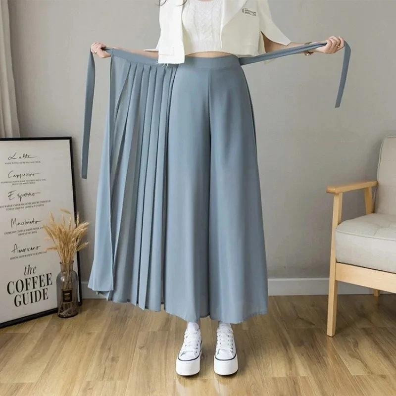 Женские шифоновые плиссированные брюки Hakama, повседневные широкие брюки с высокой талией в Корейском стиле, весна-лето 2022
Женские шифоновые плиссированные брюки Hakama, повседневные широкие брюки с высокой талией в Корейском стиле, весна-лето 2022