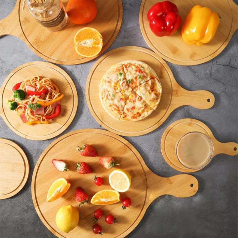 Бамбуковая деревянная доска для пиццы, круглая с ручной основой для выпечки пиццы, каменная разделочная доска для пиццы, зеркальная разделочная доска для пиццы
Бамбуковая деревянная доска для пиццы, круглая с ручной основой для выпечки пиццы, каменная разделочная доска для пиццы, зеркальная разделочная доска для пиццы