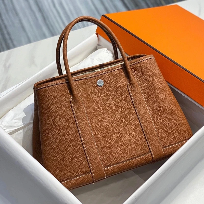 Doris Fanny 2022 Casual Totes Luxury Togo Calfskin Women's Bag Classic Large Capacity Designer Handbags Party Bags Top Quality
Doris Fanny 2022 Casual Totes Luxury Togo Calfskin Women's Bag Classic Large Capacity Designer Handbags Party Bags Top Quality
