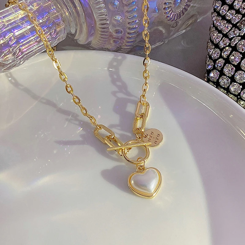 Baroque Dainty Pearl Tiny Heart Necklaces Women Hot Sale French Romantic Style Clavicle Chain Simple Girl Gift Prom Accessories
Baroque Dainty Pearl Tiny Heart Necklaces Women Hot Sale French Romantic Style Clavicle Chain Simple Girl Gift Prom Accessories
