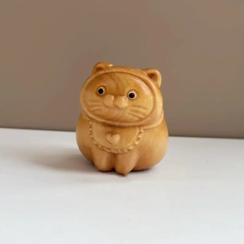 Деревянная статуэтка кота счастья
Деревянная статуэтка кота счастья