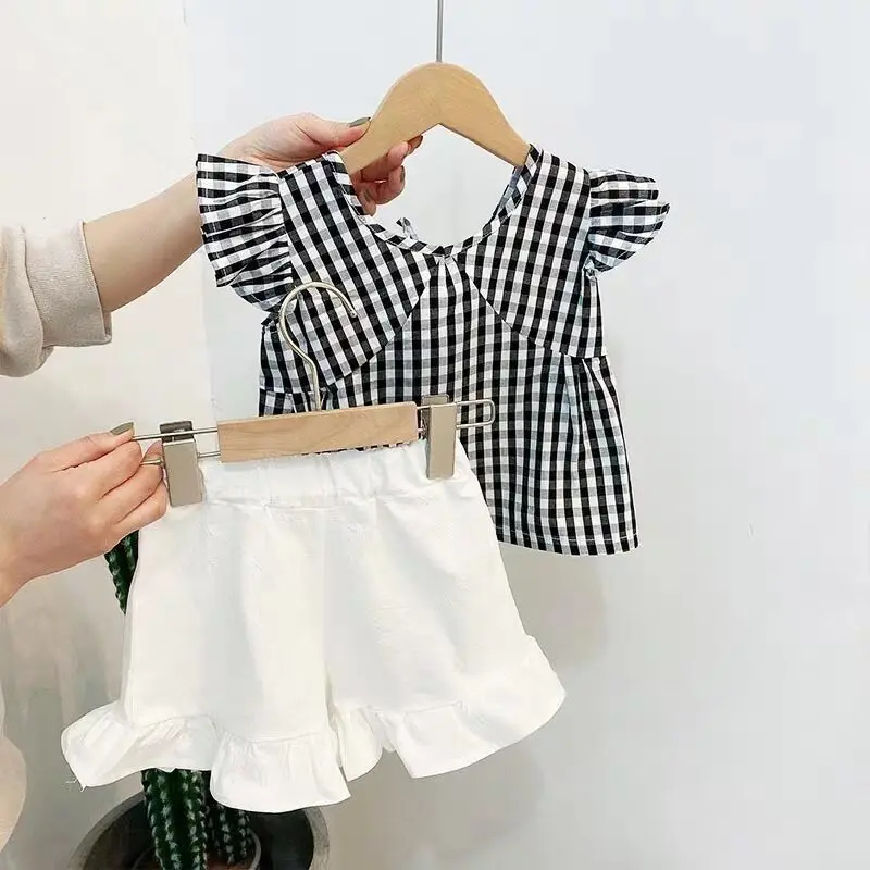 Plaid 2 Pieces Girls Shorts Sets Summer 2022 Flare Blouse And White Ruffles Shorts Sweet Style Kids Children Clothing Suits
Plaid 2 Pieces Girls Shorts Sets Summer 2022 Flare Blouse And White Ruffles Shorts Sweet Style Kids Children Clothing Suits