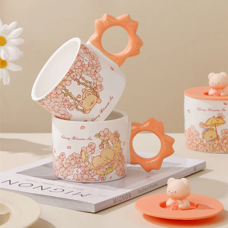 Creative Cherry Blossom Bear Ceramic Mug Creative Mug With Silicone cover Hand Gift Holiday Gift Cute Couple Coffe Cup Drinkware
Creative Cherry Blossom Bear Ceramic Mug Creative Mug With Silicone cover Hand Gift Holiday Gift Cute Couple Coffe Cup Drinkware