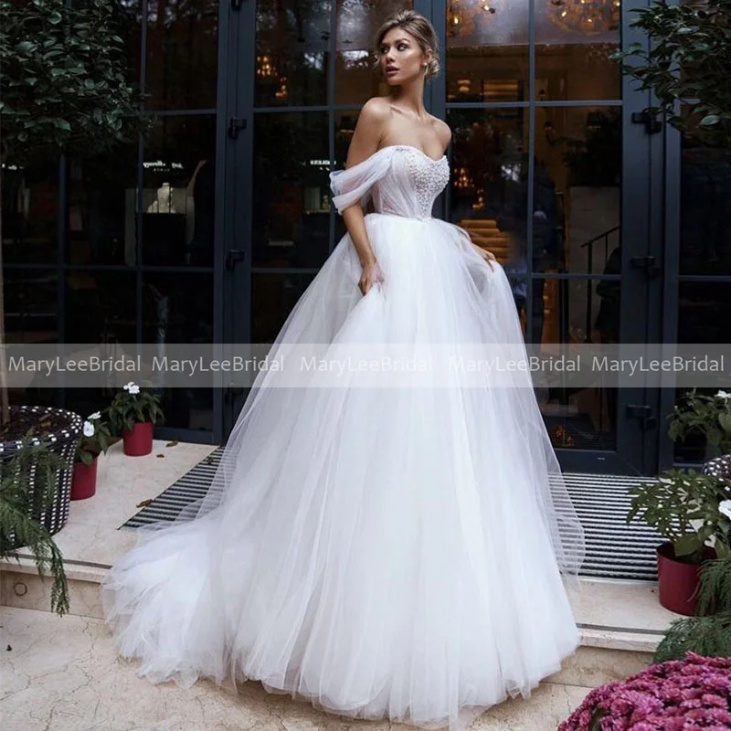 White Puffy Tulle Princess Wedding Dresses for Women Glamorous Off Shoulder Shiny Beads Ball Gown Bridal Dress Vestidos De Novia
White Puffy Tulle Princess Wedding Dresses for Women Glamorous Off Shoulder Shiny Beads Ball Gown Bridal Dress Vestidos De Novia