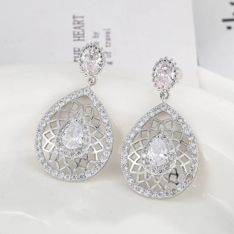 Hot New Luxury White Drop Hollow Zirconia Earrings Bohemian Art Style Fashion Designer Design Exquisite Women's Wedding Jewelry
Hot New Luxury White Drop Hollow Zirconia Earrings Bohemian Art Style Fashion Designer Design Exquisite Women's Wedding Jewelry