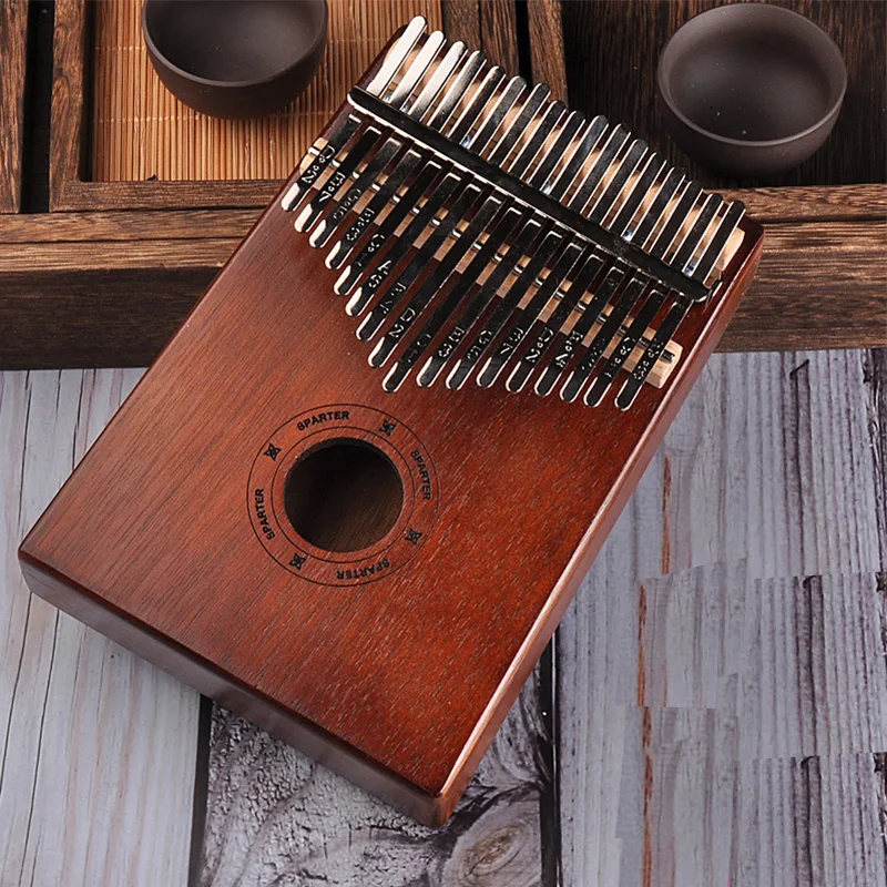 Kalimba 17 Keys Thumb Piano High Quality Handguard Wood Mahogany Mbira Body Musical Instruments Kalimba Piano Creative Music Box
Kalimba 17 Keys Thumb Piano High Quality Handguard Wood Mahogany Mbira Body Musical Instruments Kalimba Piano Creative Music Box