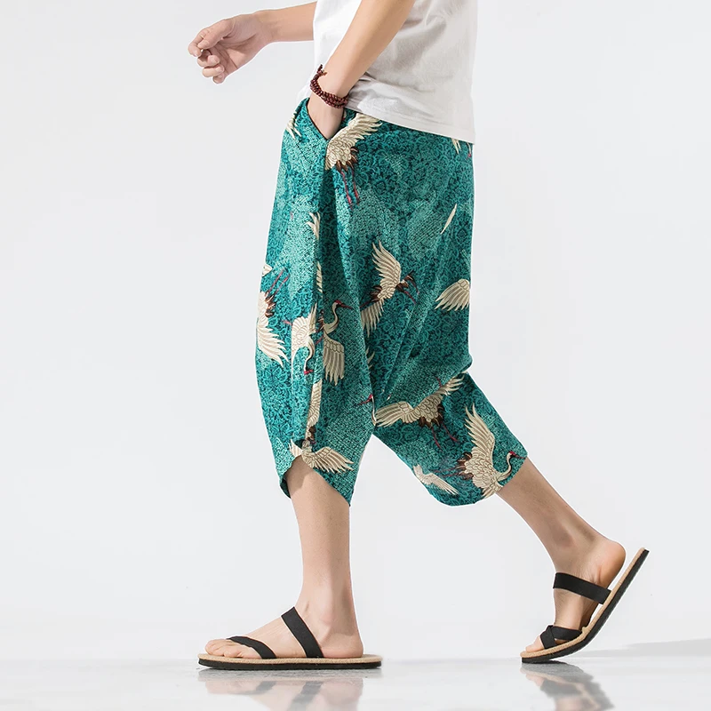 Брюки мужские с широким шаговым швом, свободные укороченные штаны, шаровары с широкими штанинами, мешковатая уличная одежда с принтом в Корейском стиле, 5XL 
Брюки мужские с широким шаговым швом, свободные укороченные штаны, шаровары с широкими штанинами, мешковатая уличная одежда с принтом в Корейском стиле, 5XL