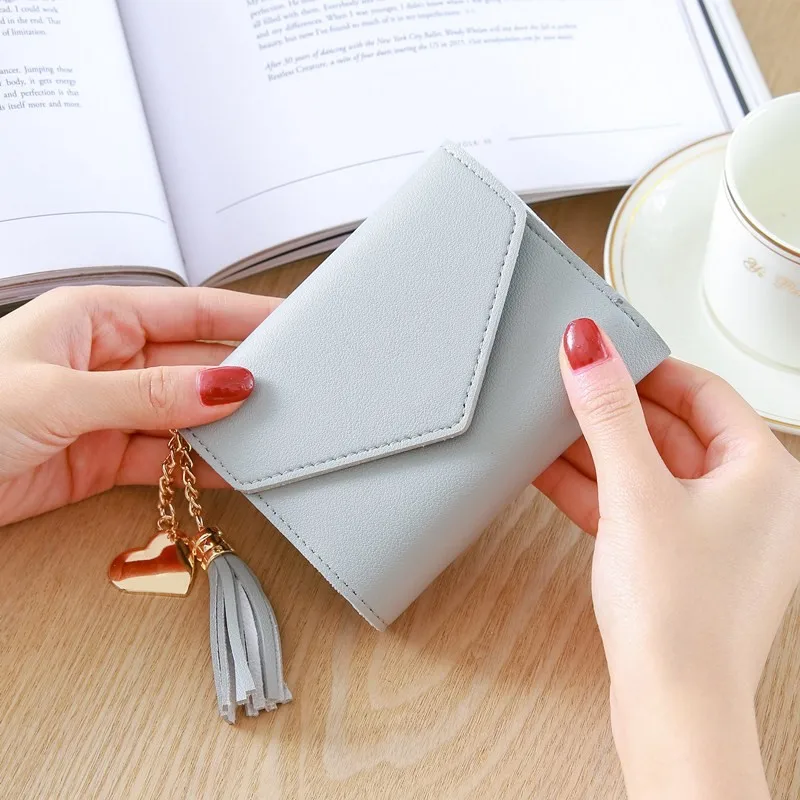 Korean Short Wallet Female 2021 Spring New Mini Tassel Pendant Thin Wallet Card Holder Small Fresh Student Buckle Coin Purse
Korean Short Wallet Female 2021 Spring New Mini Tassel Pendant Thin Wallet Card Holder Small Fresh Student Buckle Coin Purse