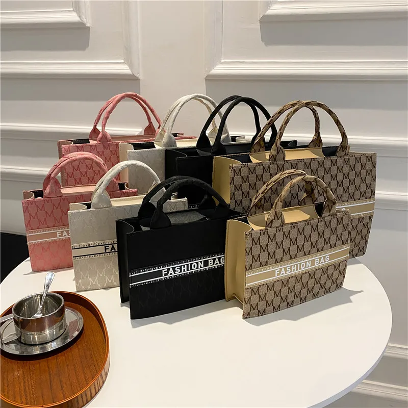 2022 Canvas Alphabet Simple Tote Bag Retro Fashion Casual Personality Bag for Women Crossbody Bag
2022 Canvas Alphabet Simple Tote Bag Retro Fashion Casual Personality Bag for Women Crossbody Bag