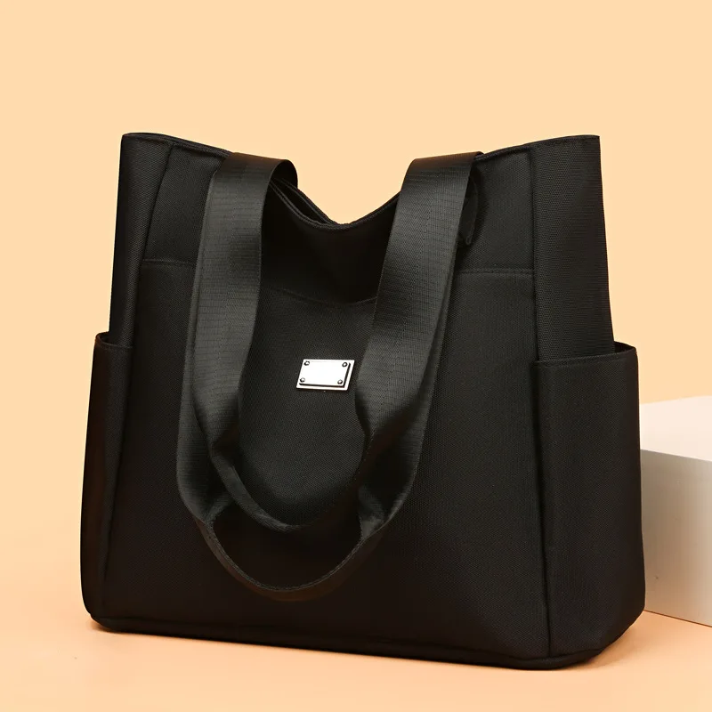 2023 New Women's Handbag Shoulder Bag Popular Simple Solid Color High Capacity Nylon Bag
2023 New Women's Handbag Shoulder Bag Popular Simple Solid Color High Capacity Nylon Bag