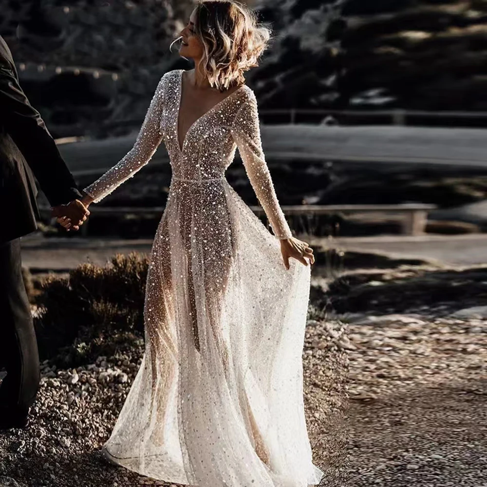 Glitter Beach Wedding Dresses Sexy Backless Long Sleeves Bride Dresses Deep V-Neck Sequined Lace A-Line Wedding Gowns
Glitter Beach Wedding Dresses Sexy Backless Long Sleeves Bride Dresses Deep V-Neck Sequined Lace A-Line Wedding Gowns