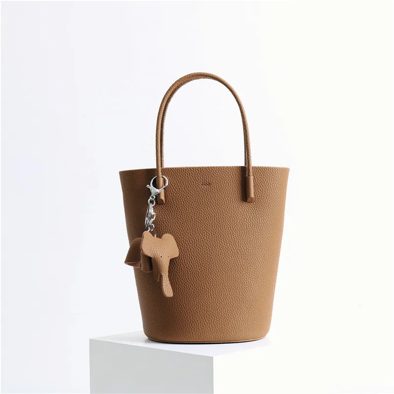 Leather and cowhide women's bag new style handbag in spring 2022, fashionable and versatile, niche design, Messenger Bucket Bag 
Leather and cowhide women's bag new style handbag in spring 2022, fashionable and versatile, niche design, Messenger Bucket Bag