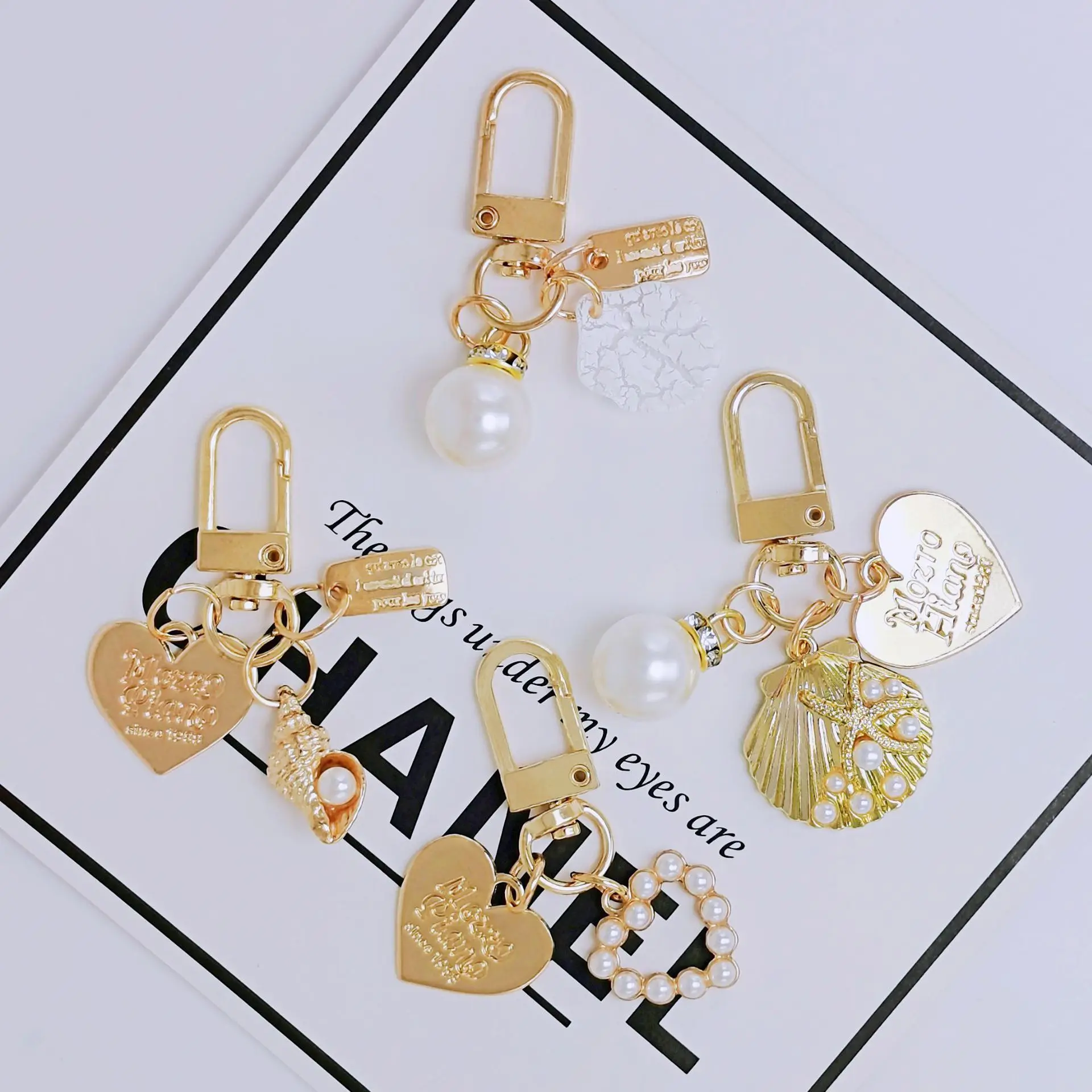 Pearl shell key chain brand alloy key chain wholesale metal love bag pendant ins pendant
Pearl shell key chain brand alloy key chain wholesale metal love bag pendant ins pendant