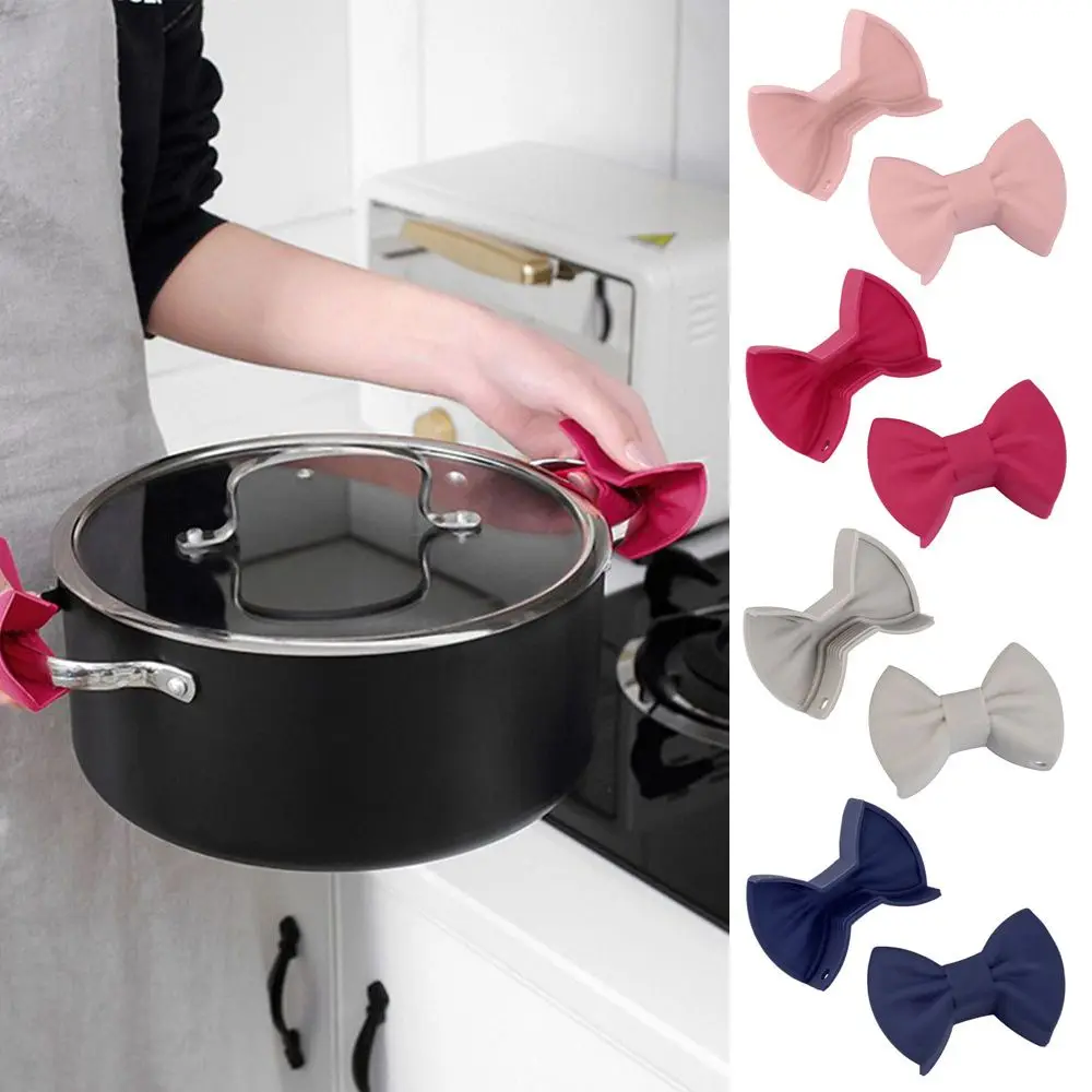 2Pcs/set Bowknot Silicone Heat Insulation Kitchen Pot Clip Finger Protector Pinch Resistant Non-Slip Holder Cooking Oven Glove 
2Pcs/set Bowknot Silicone Heat Insulation Kitchen Pot Clip Finger Protector Pinch Resistant Non-Slip Holder Cooking Oven Glove