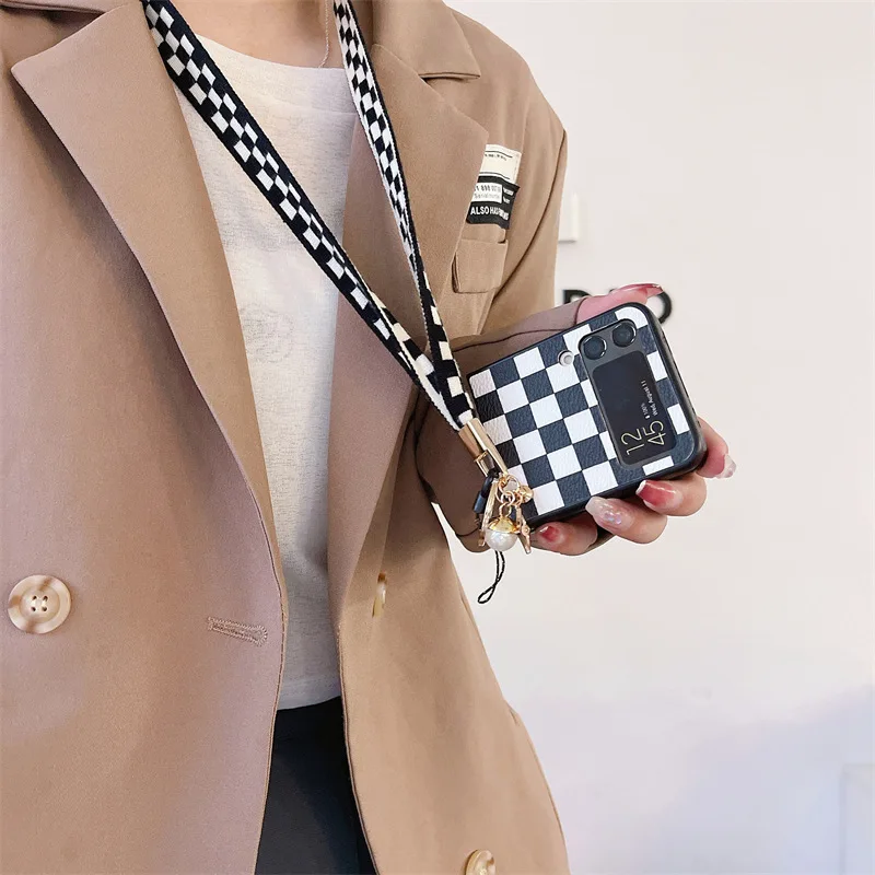Checkerboard Lanyard Phone Case for Samsung Galaxy Z Flip 3 Z Flip 4 Hard PC Back Cover for ZFlip3 ZFlip4 Case Shell
Checkerboard Lanyard Phone Case for Samsung Galaxy Z Flip 3 Z Flip 4 Hard PC Back Cover for ZFlip3 ZFlip4 Case Shell