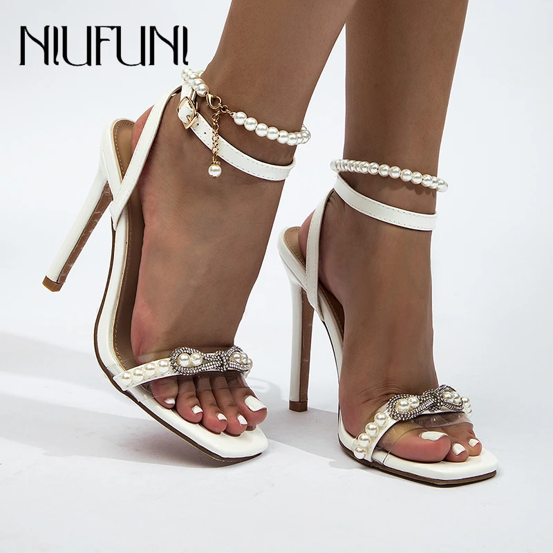 Square Toe Beige Pearl Beads Rhinestone Bow Women's Sandals Solid Color High Heels Fashion Gladiator Shoes Elastic Belt Stiletto
Square Toe Beige Pearl Beads Rhinestone Bow Women's Sandals Solid Color High Heels Fashion Gladiator Shoes Elastic Belt Stiletto