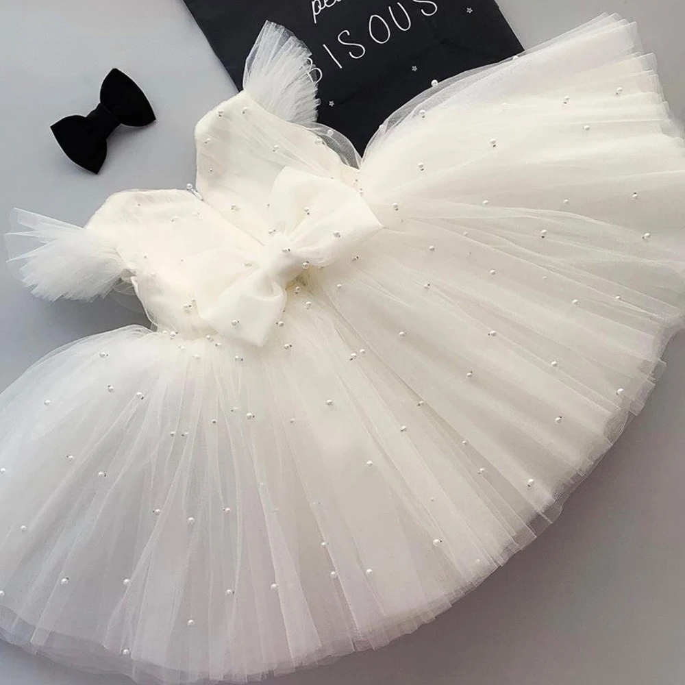 Pearls Baby Birthday Party Dress A Line Satin Bow Ball Gown Tulle White Cap Sleeves Flower Girl Dresses
Pearls Baby Birthday Party Dress A Line Satin Bow Ball Gown Tulle White Cap Sleeves Flower Girl Dresses