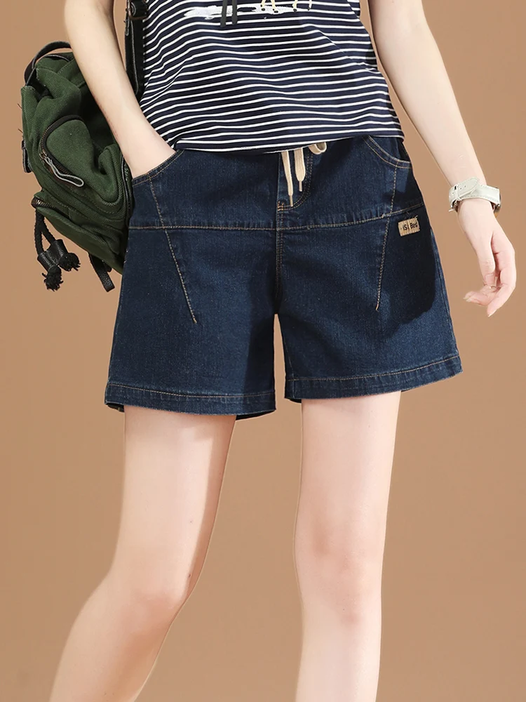 Женские короткие джинсовые брюки HCXR, повседневные свободные темно-синие корейские модные брюки с эластичным шнурком на талии и широкими штанинами, лето 2023
Женские короткие джинсовые брюки HCXR, повседневные свободные темно-синие корейские модные брюки с эластичным шнурком на талии и широкими штанинами, лето 2023