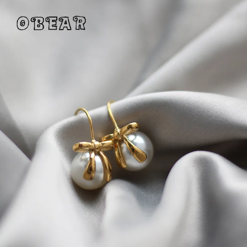 French Temperament Bow Ribbon Imitation Pearl Earrings for Women Girl Stainless Steel Plated 18K Gold Jewelry Wholesale
French Temperament Bow Ribbon Imitation Pearl Earrings for Women Girl Stainless Steel Plated 18K Gold Jewelry Wholesale