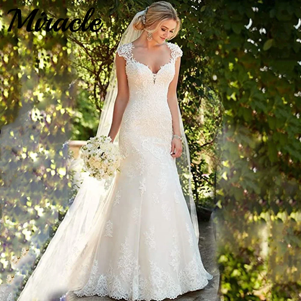 Lace Appliques Mermaid Wedding Dress Backless Cap Sleeve Trumpet Bride Dresses Sweetheart Vestido De Novia Robe De Mariée 
Lace Appliques Mermaid Wedding Dress Backless Cap Sleeve Trumpet Bride Dresses Sweetheart Vestido De Novia Robe De Mariée
