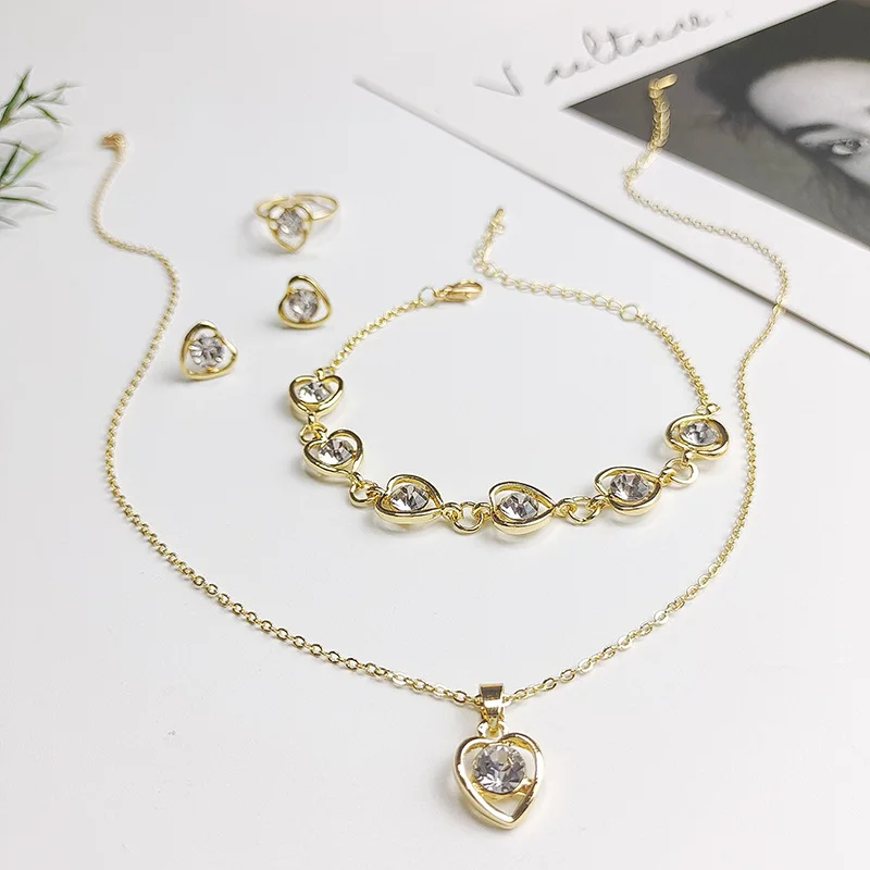 4 Pieces Hollow Heart Zircon Pendant Necklace Earrings Bracelet Ring Fashion Ladies Color Irregular Heart Zircon Set Hot
4 Pieces Hollow Heart Zircon Pendant Necklace Earrings Bracelet Ring Fashion Ladies Color Irregular Heart Zircon Set Hot
