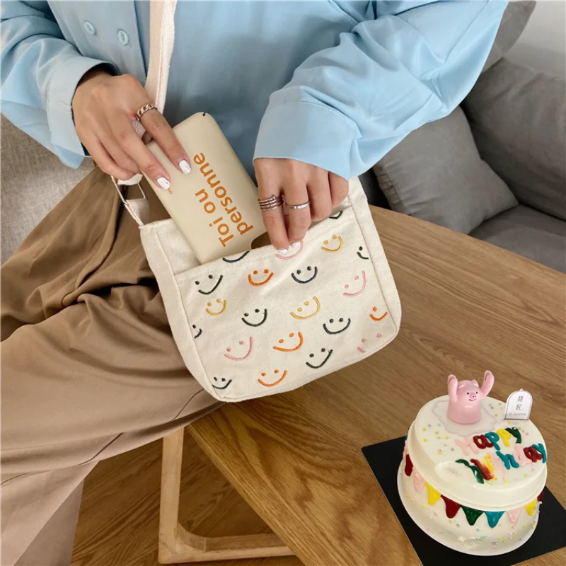 Fashion Women Cute Smile Shoulder Bag Female Ins Student Mobile Phone Canvas Bag Classic Ladies Handbags Shopping Bags
Fashion Women Cute Smile Shoulder Bag Female Ins Student Mobile Phone Canvas Bag Classic Ladies Handbags Shopping Bags