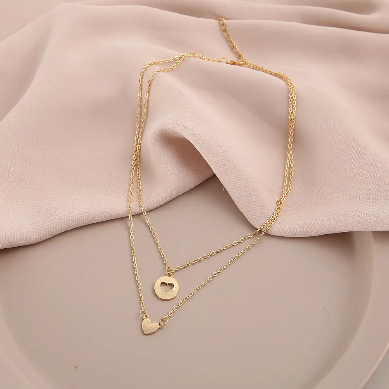 Trendy Clavicle Chain Simple Multi-layered Heart Pendant Necklace Party Jewelry Accessories for Women
Trendy Clavicle Chain Simple Multi-layered Heart Pendant Necklace Party Jewelry Accessories for Women