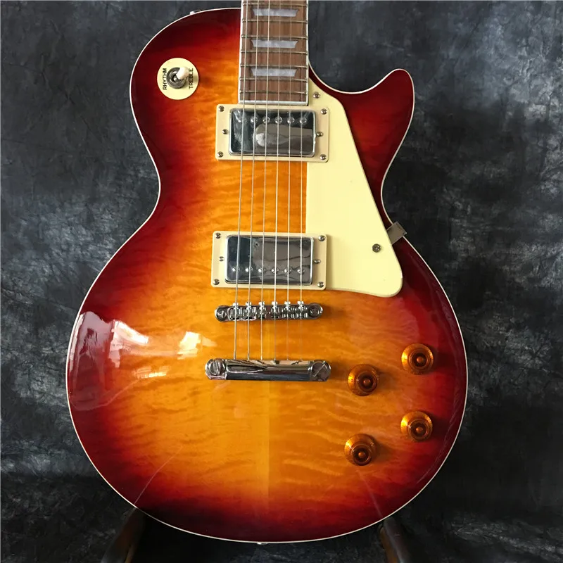Classic electric guitar mahogany wood body with flamed maple top good sound quality new style, free shipping
Classic electric guitar mahogany wood body with flamed maple top good sound quality new style, free shipping
