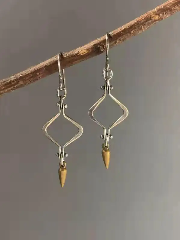 Mixed metal earrings, silver color, brass, hand forged, steampunk, steam punk jewelry, industrial, spike, oxidized patina rivets 
Mixed metal earrings, silver color, brass, hand forged, steampunk, steam punk jewelry, industrial, spike, oxidized patina rivets