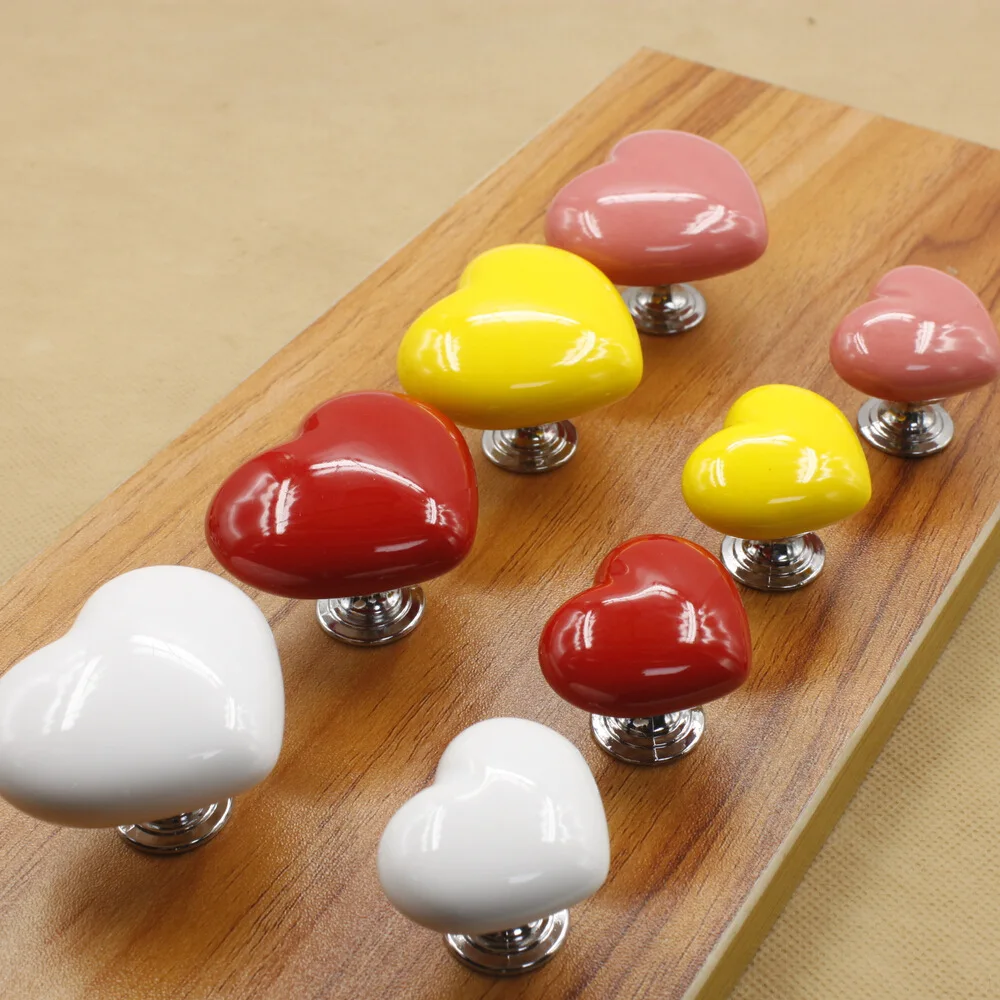 Color heart-shaped ceramic handle modern simple wardrobe drawer cabinet door Chinese single hole furniture hardware handle
Color heart-shaped ceramic handle modern simple wardrobe drawer cabinet door Chinese single hole furniture hardware handle