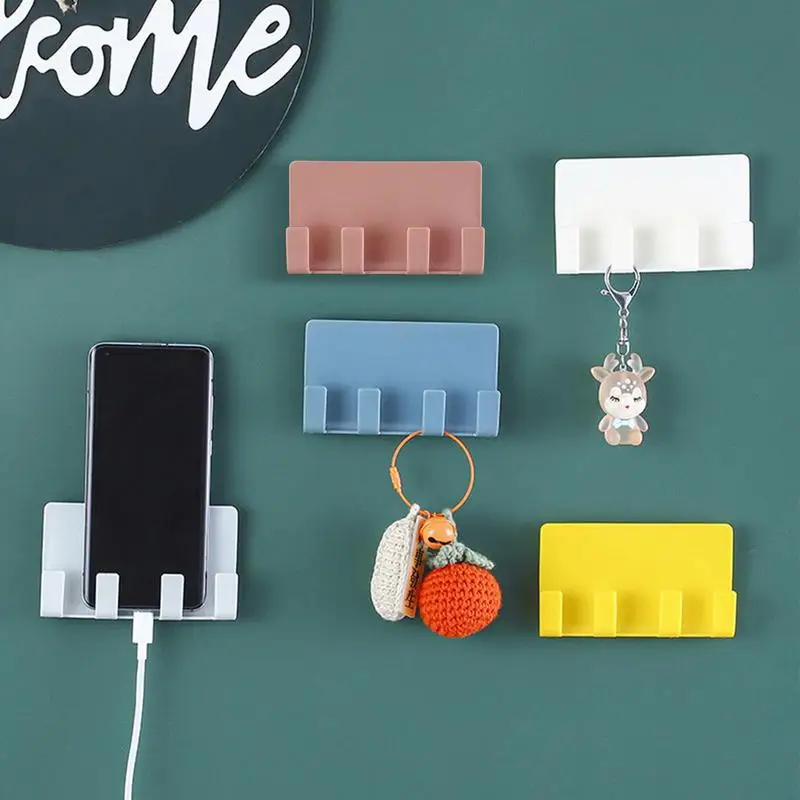 Wall Mounted Mobile Phone Holder Punch Free Holder Remote Control Storage Box Charger Hook Keys Cable Charging Dock Stand
Wall Mounted Mobile Phone Holder Punch Free Holder Remote Control Storage Box Charger Hook Keys Cable Charging Dock Stand