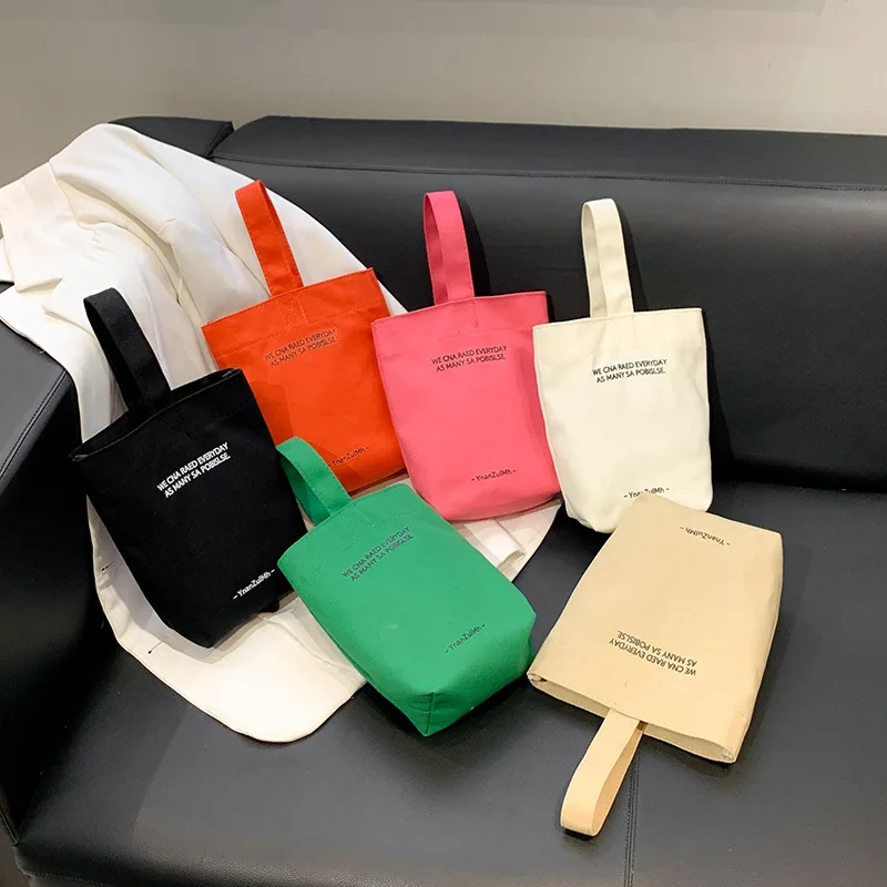 New Minimalist Style Mini Portable Canvas Bag Lunch Bag Candy Color Kettle Wrist Strap Plain Canvas Bag
New Minimalist Style Mini Portable Canvas Bag Lunch Bag Candy Color Kettle Wrist Strap Plain Canvas Bag