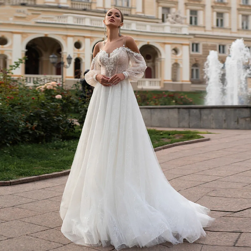 Puff Long Sleeve O-Neck Vestido De Noiva Lace Appliques Shiny Tulle Wedding Gown Beach Bride Dress 2022
Puff Long Sleeve O-Neck Vestido De Noiva Lace Appliques Shiny Tulle Wedding Gown Beach Bride Dress 2022