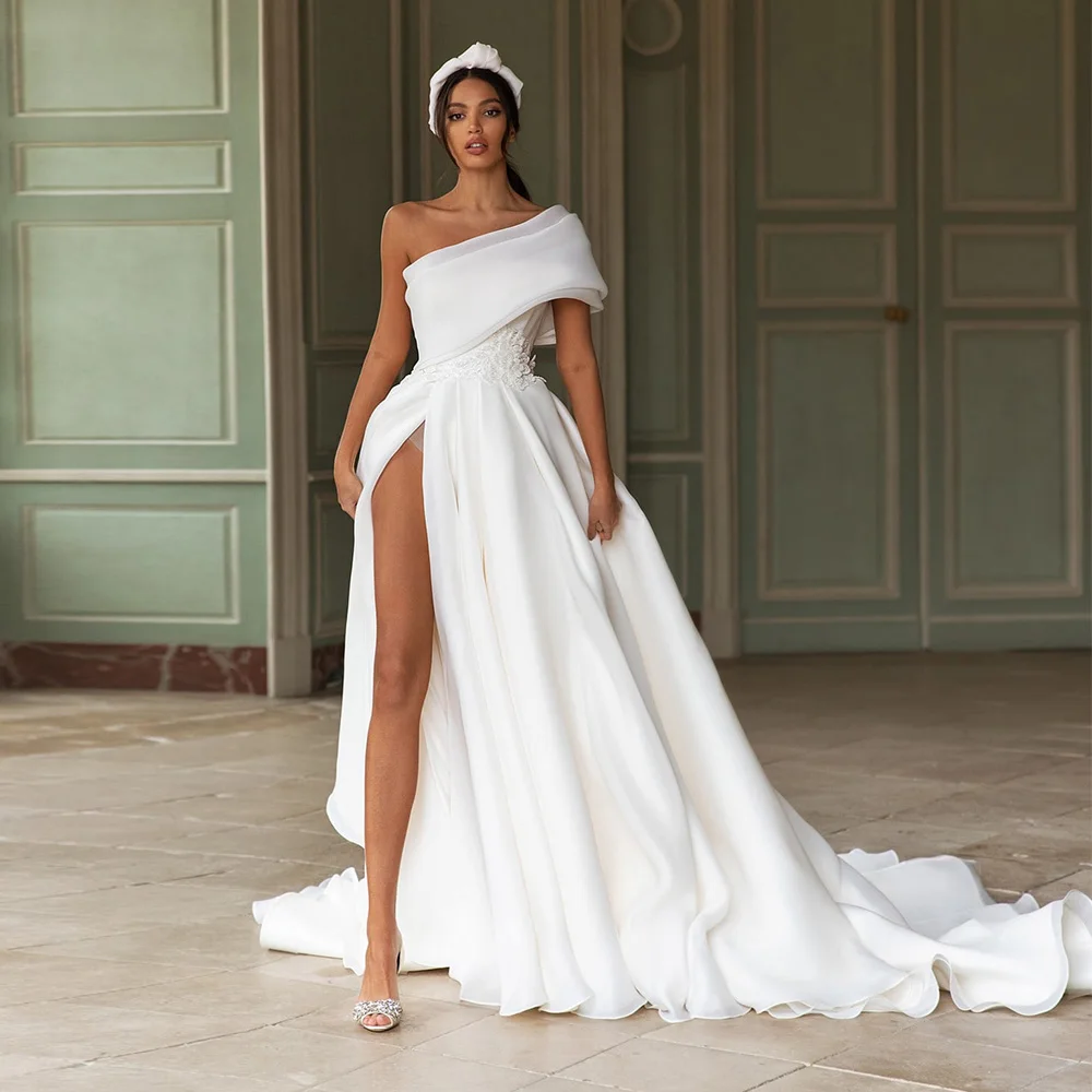 Organza Wedding Dress One Shoulder Sexy Trouwjurk Slit Skirt Simple Abito Da Sposa Bow Back Hochzeitskleid
Organza Wedding Dress One Shoulder Sexy Trouwjurk Slit Skirt Simple Abito Da Sposa Bow Back Hochzeitskleid