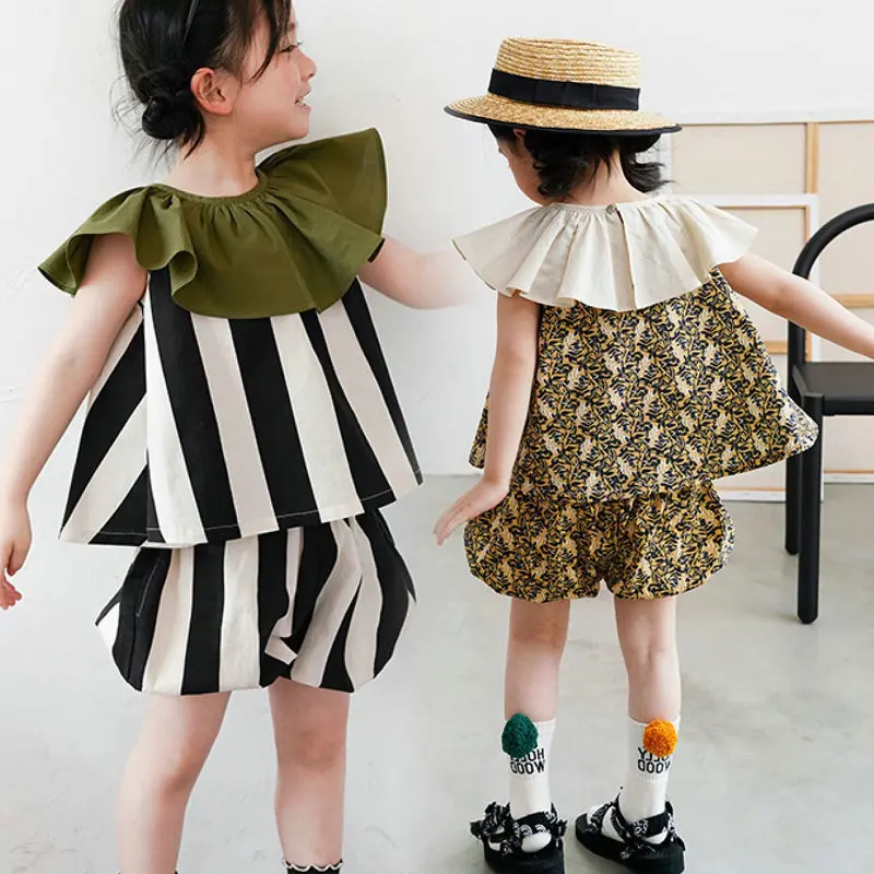 Summer Girl's clothing Suit Solid Color Crewneck Flutter Sleeve Striped Top And Shorts Comfortable And Cool Kids Clothes
Summer Girl's clothing Suit Solid Color Crewneck Flutter Sleeve Striped Top And Shorts Comfortable And Cool Kids Clothes