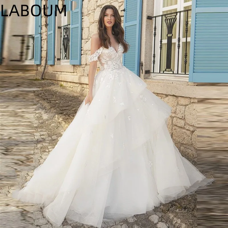 LaBoum элегантное Тюлевое сказочное свадебное платье принцессы для женщин 2023 с открытыми плечами Кружевная аппликация трапециевидные Пышные свадебные бальные платья
LaBoum элегантное Тюлевое сказочное свадебное платье принцессы для женщин 2023 с открытыми плечами Кружевная аппликация трапециевидные Пышные свадебные бальные платья