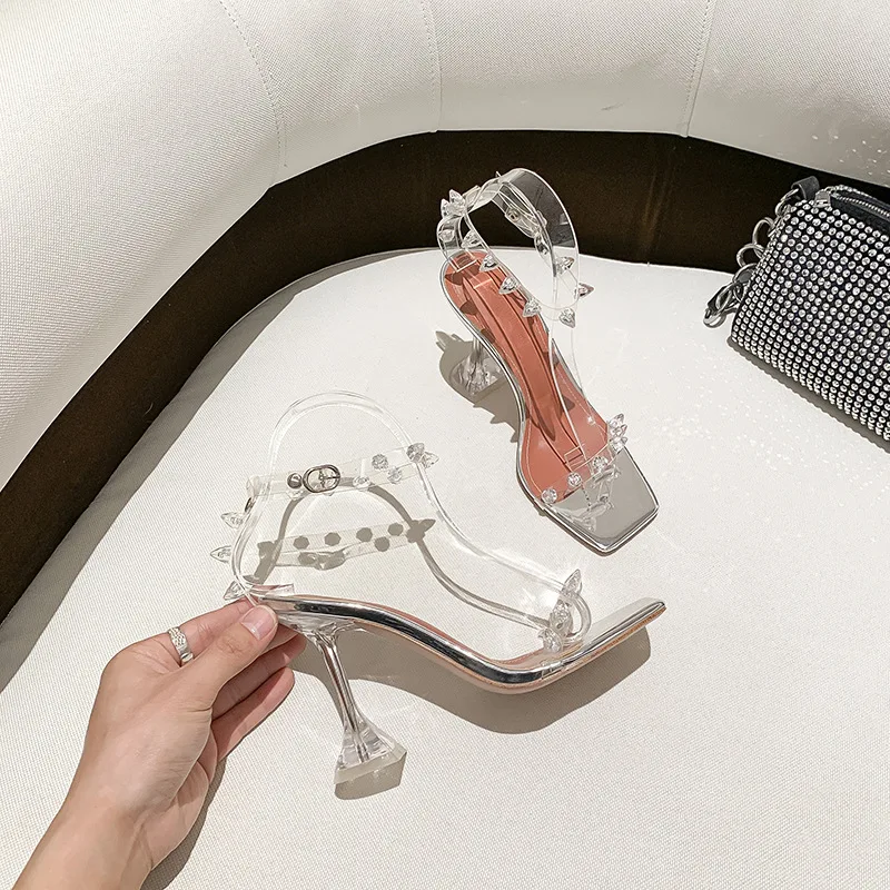2022 Spring New Transparent Rivet High-heeled Shoes with A Word Belt for Women's Slippers
2022 Spring New Transparent Rivet High-heeled Shoes with A Word Belt for Women's Slippers