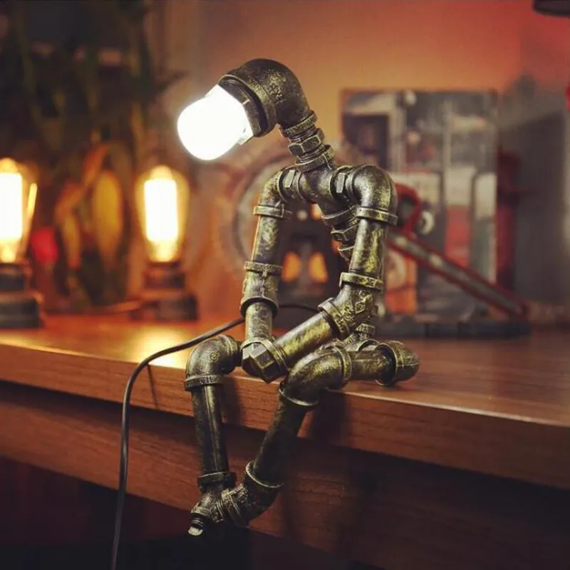 American Metal Water Pipe Robot Desk Lamp Industrial Retro Iron Pipe Model Glowing Toy Boy Birthday Gift Coffee Bar Decoration
American Metal Water Pipe Robot Desk Lamp Industrial Retro Iron Pipe Model Glowing Toy Boy Birthday Gift Coffee Bar Decoration