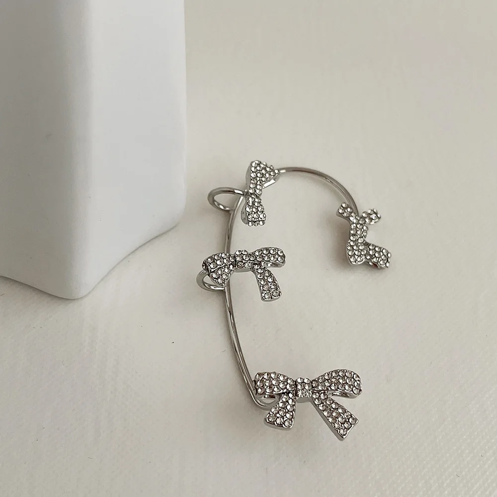 Minar Delicate Full Shiny Rhinestone Cross Knotted Charm Earrings for Women Silver Color Metallic Clip Earrings Accessories
Minar Delicate Full Shiny Rhinestone Cross Knotted Charm Earrings for Women Silver Color Metallic Clip Earrings Accessories