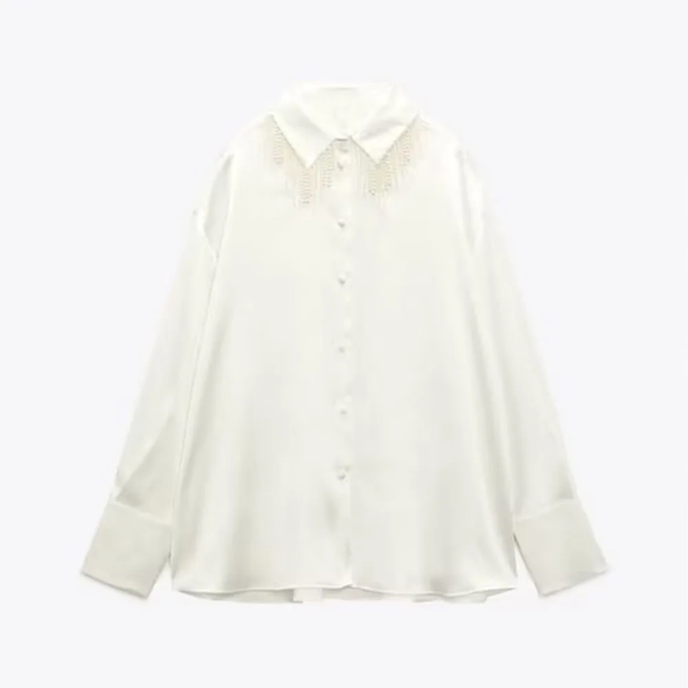Fall new fashion women's casual versatile lapel long sleeve faux pearl tassel design silk satin textured shirt
Fall new fashion women's casual versatile lapel long sleeve faux pearl tassel design silk satin textured shirt