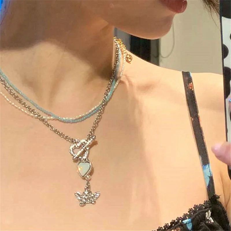 Retro OT Buckle Short Pearl and Blue Beaded Chain Necklace with Heart Pendant for Women
Retro OT Buckle Short Pearl and Blue Beaded Chain Necklace with Heart Pendant for Women