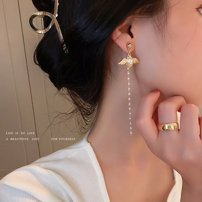 925 Silver Needle Pearl Love Wings Tassel Earrings Female Korean Temperament Girl Fashion Show Face Thin
925 Silver Needle Pearl Love Wings Tassel Earrings Female Korean Temperament Girl Fashion Show Face Thin