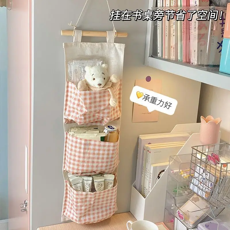 Fabric storage hanging bag wall hanging rack student dormitory bed hanging book bag bedroom sundry storage bag
Fabric storage hanging bag wall hanging rack student dormitory bed hanging book bag bedroom sundry storage bag
