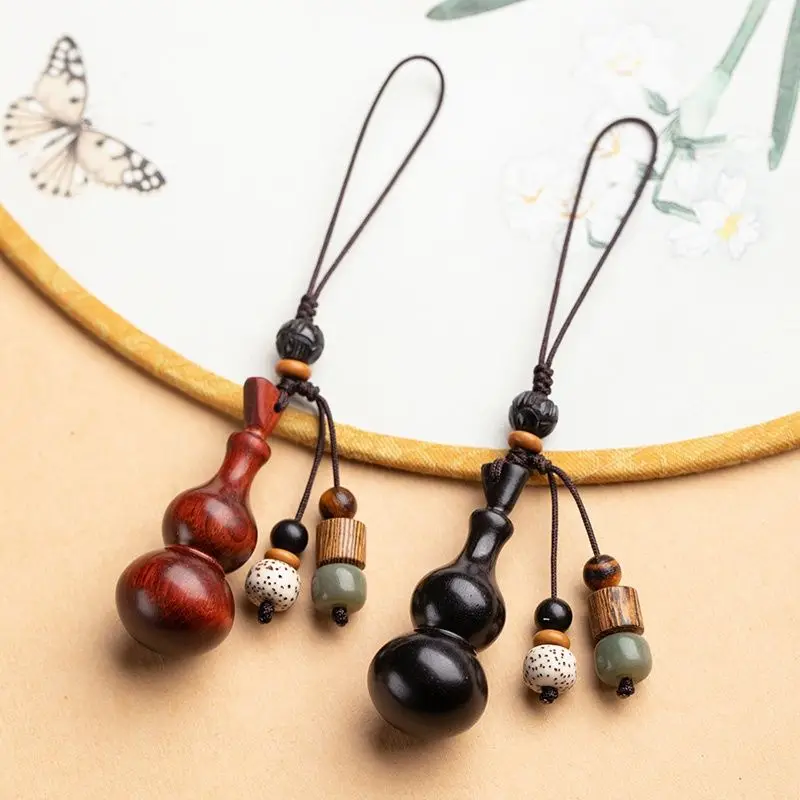 Black sandalwood small gourd mobile phone pendant U disk pendant pendant jewelry Chinese style red sandalwood retro pendant 
Black sandalwood small gourd mobile phone pendant U disk pendant pendant jewelry Chinese style red sandalwood retro pendant