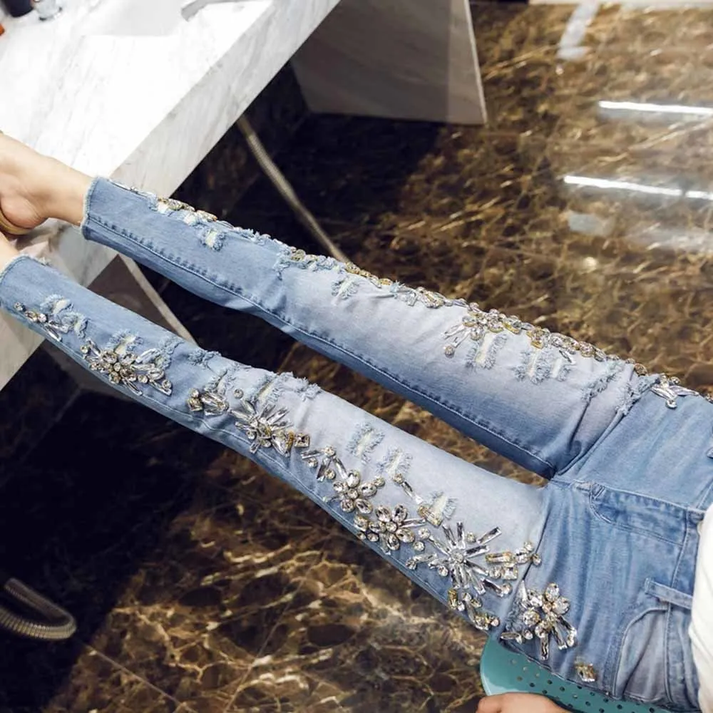 Top Fashion Women's Handmade Beaded Jeans Lady Rhinestones Diamond Denim Jeans Hole Skinny High Stretch Pencil Pants 
Top Fashion Women's Handmade Beaded Jeans Lady Rhinestones Diamond Denim Jeans Hole Skinny High Stretch Pencil Pants