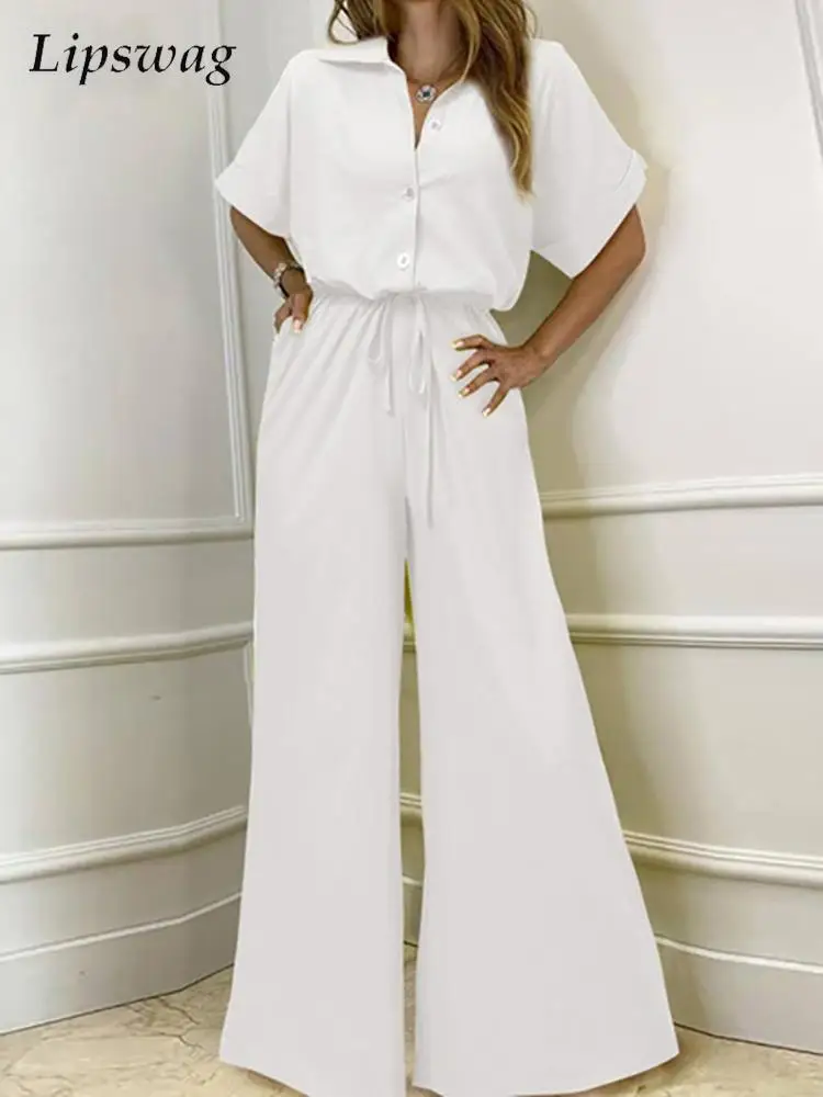 Elegant Lapel Short Sleeve Shirt Jumpsuits Women Fashion Solid Single-breasted Playsuits Overalls Casual Bandage Wide Leg Romper
Elegant Lapel Short Sleeve Shirt Jumpsuits Women Fashion Solid Single-breasted Playsuits Overalls Casual Bandage Wide Leg Romper