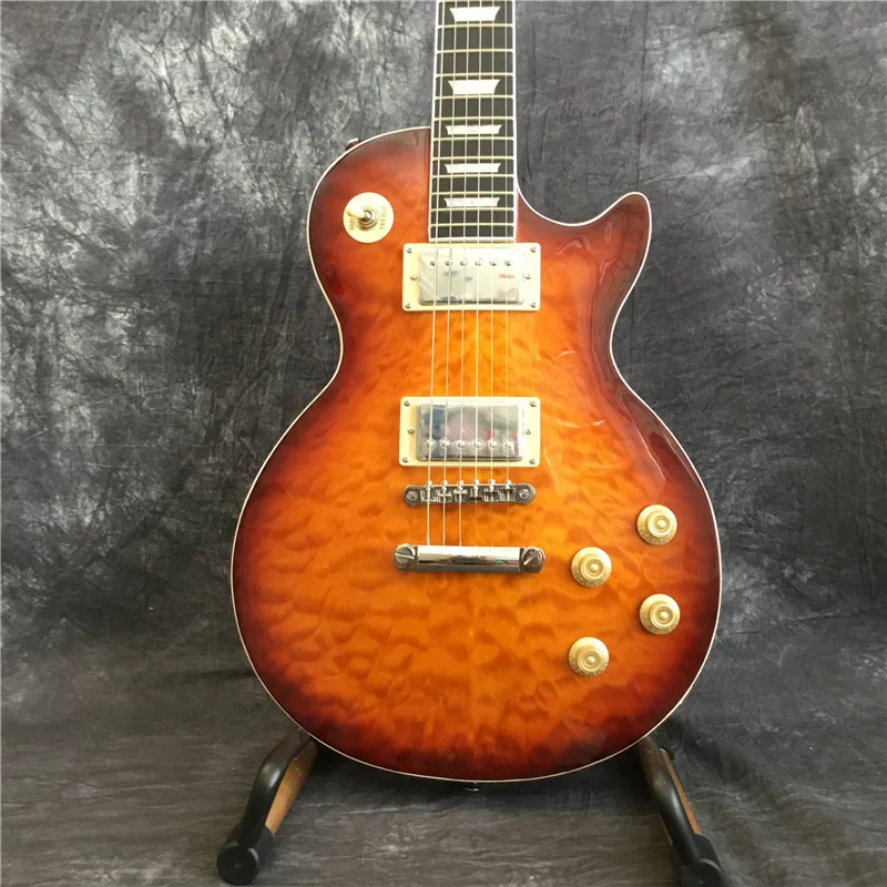 High quality quilted top electric guitar, high quality pickup guitar, rosewood fingerboard. Mahogany body
High quality quilted top electric guitar, high quality pickup guitar, rosewood fingerboard. Mahogany body