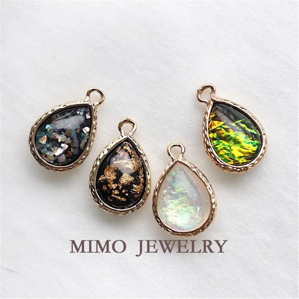 Color copper gold plated edge teardrop imitation dazzling color Opal gold foil shell pendant DIY accessories
Color copper gold plated edge teardrop imitation dazzling color Opal gold foil shell pendant DIY accessories