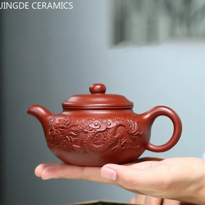Античная сырая руда Dahongpao фильтр чайный горшок Исин фиолетовая глина чайные горшки знаменитый чайник ручной работы с рисунком дракона дорожный чайный набор 210 мл
Античная сырая руда Dahongpao фильтр чайный горшок Исин фиолетовая глина чайные горшки знаменитый чайник ручной работы с рисунком дракона дорожный чайный набор 210 мл